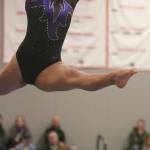 Lake Washington Highs Laly Noriega gets some air time on beam at state. Andy Nystrom / staff photo