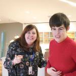 AtWork! employment counselor Emily Lord provides Paige Bisbee one-on-one support at the office. Lord helps Paige navigate around the office and communicate with her co-workers in the law firm. Stephanie Quiroz/staff photo.