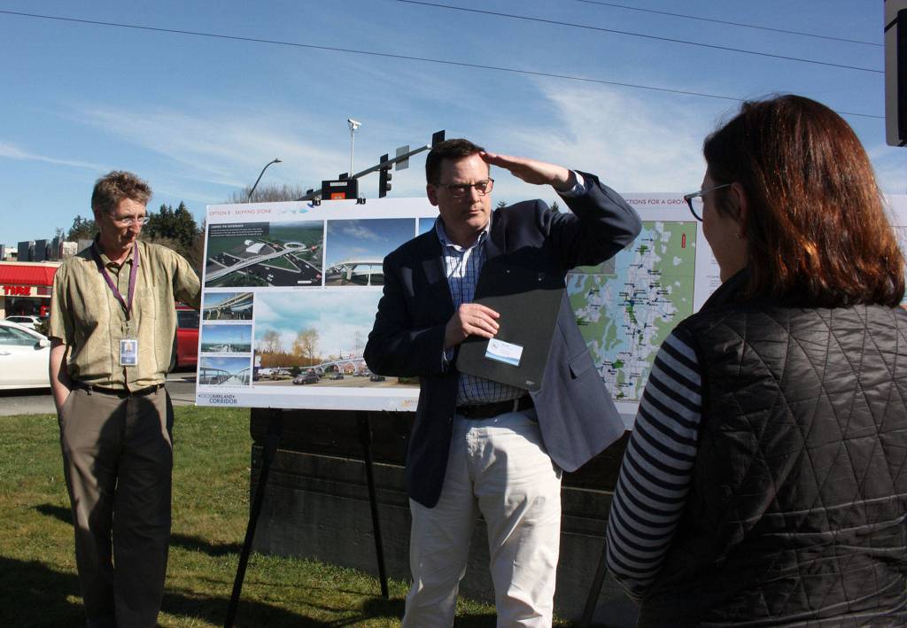 John Starbard from Kirklands public works department shows Congresswoman Suzan DelBene how the Totem Lake Connector will improve the experience for cars, pedestrians and bicyclists at the busiest intersection in the city. Katie Metzger/staff photo