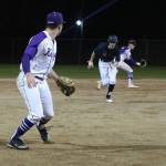 Lake Washington fielders in the midst of notching a double play to get out of the third inning. Andy Nystrom / staff photo