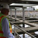 Jim Pitts stands on walkway overlooking filtration chambers at the King County South Filtration Plant in Renton. Aaron Kunkler/staff photo