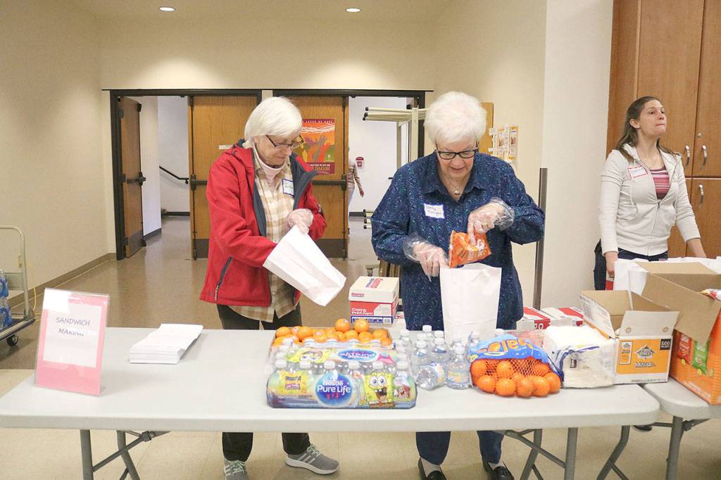 St. Jude Parish members made 125 sack lunches on March 30. Stephanie Quiroz/staff photo