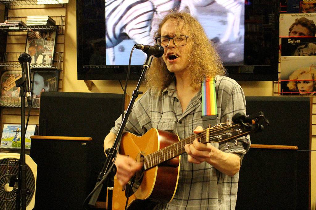 Thomas Carson (Trees and Flowers) performs Homosapien by Pete Shelley on Record Store Day. Madison Miller / staff photo