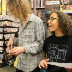 Thomas Carson (Trees and Flowers) and Meilani Eyre (Smuggling Croissants) sing and play along to Out of the Races and Onto the Tracks by The Rapture. Madison Miller / staff photo