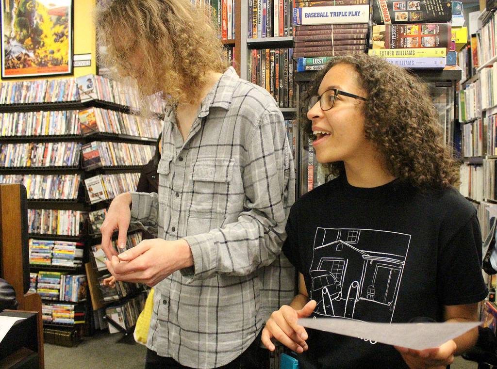 Thomas Carson (Trees and Flowers) and Meilani Eyre (Smuggling Croissants) sing and play along to Out of the Races and Onto the Tracks by The Rapture. Madison Miller / staff photo