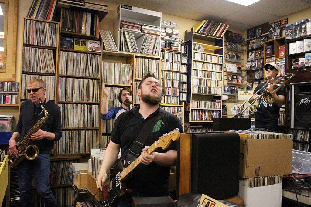 Mister Blank, an eight-piece ska band, performs at Vortex or Record Store Day. From left: Frank Smith, James Sweazea, Kyle Lever and Peter Fink. Madison Miller / staff photo