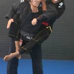 Jessica dos Santos, top, and Miriam Cardoso get in a workout at the T3MA dojo in Redmond. Andy Nystrom / staff photo