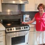 Kay Plimpton is thrilled with the way her new countertops and backsplashes from Granite Transformations of Seattle brightened up her kitchen.