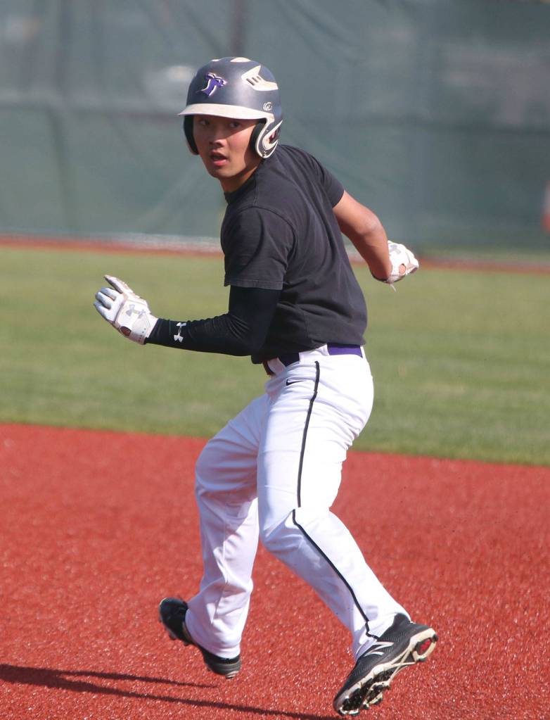 Ricky Koishida runs the bases during a scrimmage. Andy Nystrom / staff photo