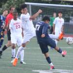 Juanita sophomore Victor Ramos Aguilar, second from left, attempts to halt a pass from Interlake senior Brandon Lazo Gutierrez. Andy Nystrom / staff photo