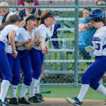 Lake Washington players mob sophomore Maddie Miller after she connected on a two-run home run in the top of the sixth inning. Lake Washington defeated Bellevue, 12-5, in the 3A KingCo tournament championship game on May 10 at Inglemoor High School in Kenmore. Photo courtesy of Patrick Krohn/Patrick Krohn Photography