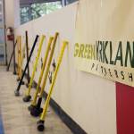 City officials celebrate the new Parks Maintenance Center after slamming sledgehammers against a short wall within the old Office Max building as a way to break ground on the renovation project. Kailan Manandic / staff photo