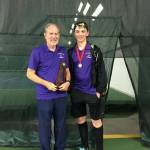 Lake Washington coach John Stalker with Brett Pearson, wearing his second-place medal. Stalker is holding the second-place team trophy. Courtesy photo