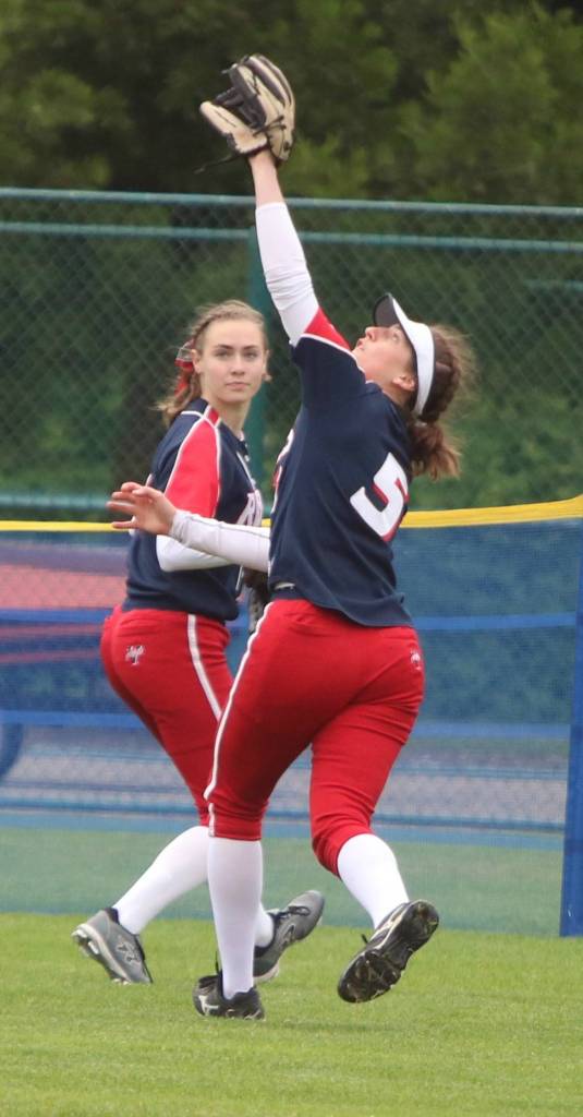 Juanitas Jordan Schroeder en route to making a catch in the outfield against Mountain View. Andy Nystrom/ staff photo