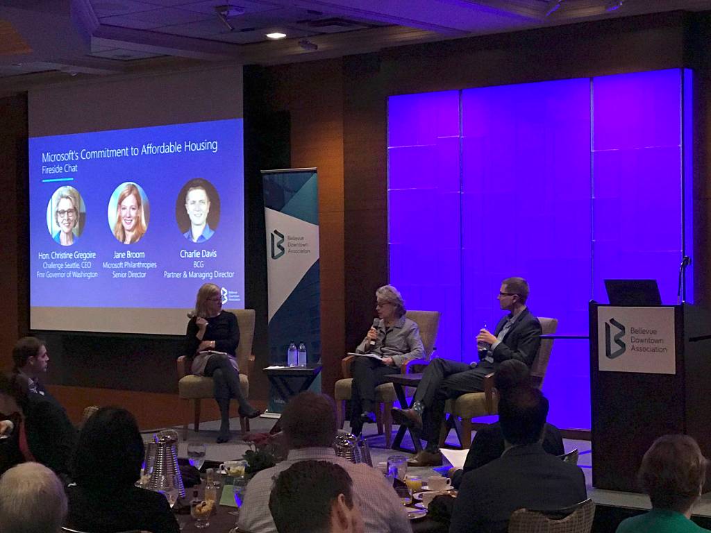 (Left to right) Jane Broom, Microsoft Philanthropies senior director, former Washongton Gov. Christine Gregoir, who now serves as CEO of Challenge Seattle, and Charlie Davis, partner and managing director at the Boston Consulting Group, speak on Microsofts $500 million commitment to affordable housing at a panel discussion during a Bellevue Downtown Association breakfast. Kailan Manandic / staff photo
