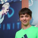 Lake Washington High tennis player Brett Pearson shares a photo with Stefan Edberg at Central Park Tennis Club. Andy Nystrom / staff photo
