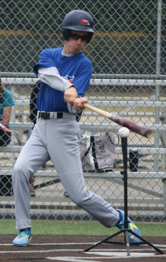 Blue Jay Doug Broberg swings away for his District 8 squad. Andy Nystrom / staff photo