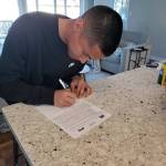 Bellevue Bulldogs sophomore basketball player Parker Manalo (pictured) signs a letter of intent with the Northwest University Eagles mens basketball program in early June. Manalo will be a junior for the Northwest Eagles during the 2019-20 season. Photo courtesy of the Bellevue Bulldogs mens basketball Twitter feed