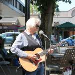 Musician Marc Antal plays at the entrance to Park Lane as people walk on to the street. Evan Pappas/Staff Photo