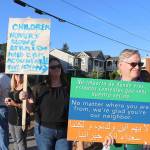Protestors hold signs that read, Children Hungry Alone Afraid. Hold CBP Accountable. Take Action, and No matter where you are from, were glad youre our neighbor on July 12. Stephanie Quiroz/staff photo