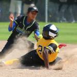 A shortstop from Bacolod City, Philippines tags out a runner from Tampa, Florida, at last years Junior League Softball World Series at Everest Park in Kirkland. Andy Nystrom / staff photo