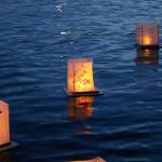 A water lantern that reads, Practice Aloha floats away on Juanita Bay. Stephanie Quiroz/staff photo