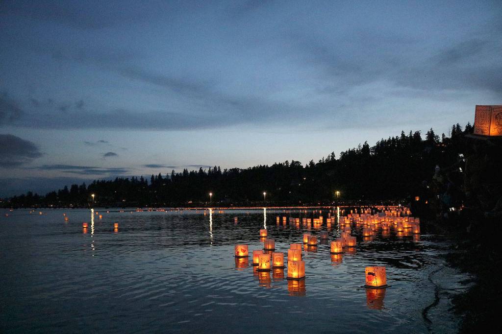 Water lanterns float on Juanita Bay at the 1,000 Lights Water Lantern Festival at Juanita Beach Park on Aug. 10. Stephanie Quiroz/staff photo