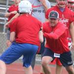 New Juanita head coach Jared Carter shows his players how its done. Andy Nystrom/ staff photo