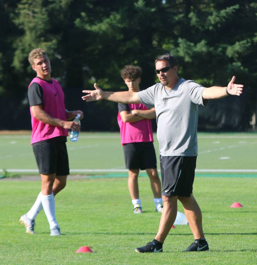 Head coach Gary McIntosh instructs his players during practice. Andy Nystrom/staff photo