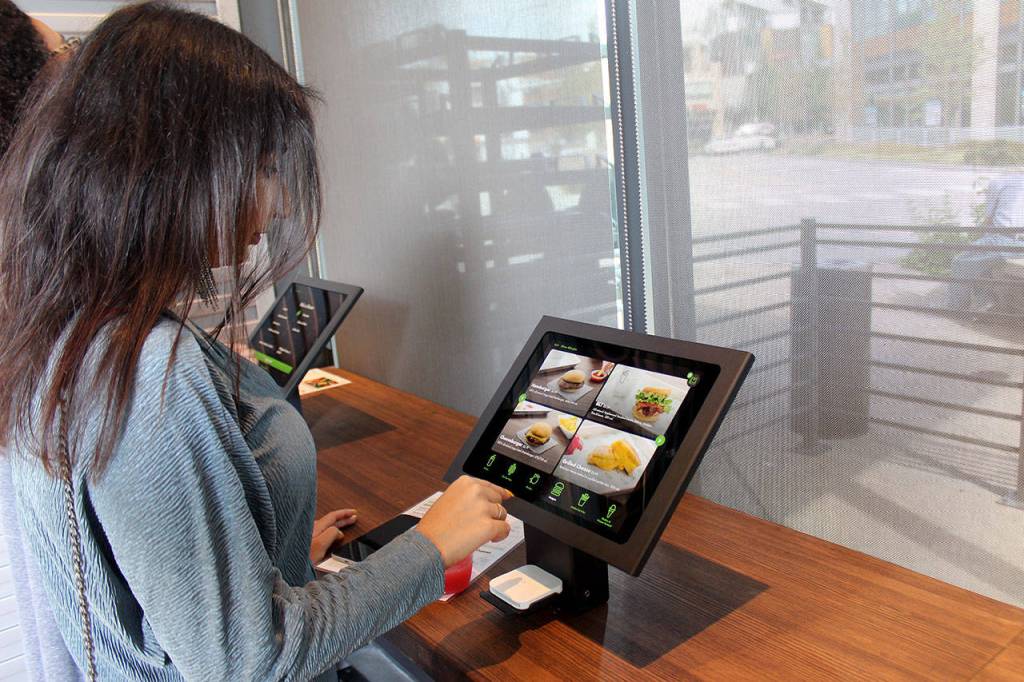 Aania Aslam, who runs the lifestyle blog Life of Aani, orders food at a kiosk during a Sept. 6 preview. Blake Peterson/staff photo