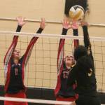 Juanitas Isabella Rogers, left, and Naomi Kern leap for a block against Inglemoor on Sept. 11. Andy Nystrom/ staff photo