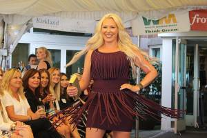 Jolene Messmer, a loan consultant at Caliber Home Loans, walks the runway at the Kirkland Chamber of Commerces sustainable fashion show on Sept. 12. Madison Miller/staff photo