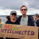 Karen Richards and Matt Armstrong held a sign that says We are all interconnected. Save everything at Fridays climate strike. Madison Miller/staff photo