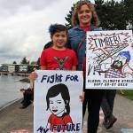 350 Eastside climate organizer, Sara Papanikolaou and her 8-year-old daughter, Tess Papanikolaou, protest at Fridays climate strike. Madison Miller/staff photo