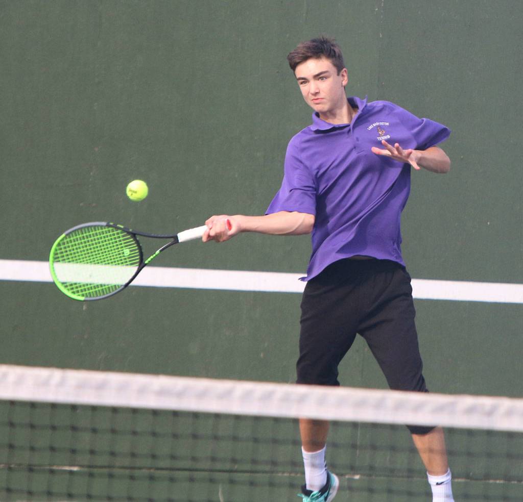 John Wehrle plays No. 2 singles for Lake Washington. Andy Nystrom/ staff photo