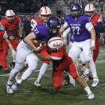 Lake Washingtons James Gardner runs up field as a Juanita defender grabs hold of the Kang. Andy Nystrom/ staff photo
