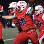 Juanitas Keegan Eby (90) celebrates his fumble recovery for a touchdown. Andy Nystrom/ staff photo