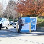 A voter drops off her ballot. Stephanie Quiroz/staff photo