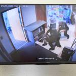 A screen shows the video captured as police arrested a 14-year-old boy at the Kirkland Teen Union Building in September. The footage was shown during a media conference in Seattle put on by the YMCA on Nov. 13. They called for Kirkland city officials to complete their ongoing investigation into the incident, promptly. Staff photo/Ashley Hiruko