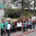 The protesters shout Hey! Ho! Climate Change has got to go! down 2nd Street in Kirkland. Madison Miller / staff photo