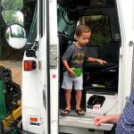 Mike Weinstein (right) with his grandson Owen at a take-your-children-to-work day event in Kirkland. Photo courtesy of Waste Management