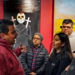 Claudio Pérez speaks with a group of students at the opening reception for the Border Doors exhibit at Centro Cultural Mexicano. Photo courtesy of Centro Cultural Mexicano
