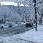 Several roads in King County, including the Snoqualmie Parkway, were closed when a brief snow storm struck the region last February. File photo