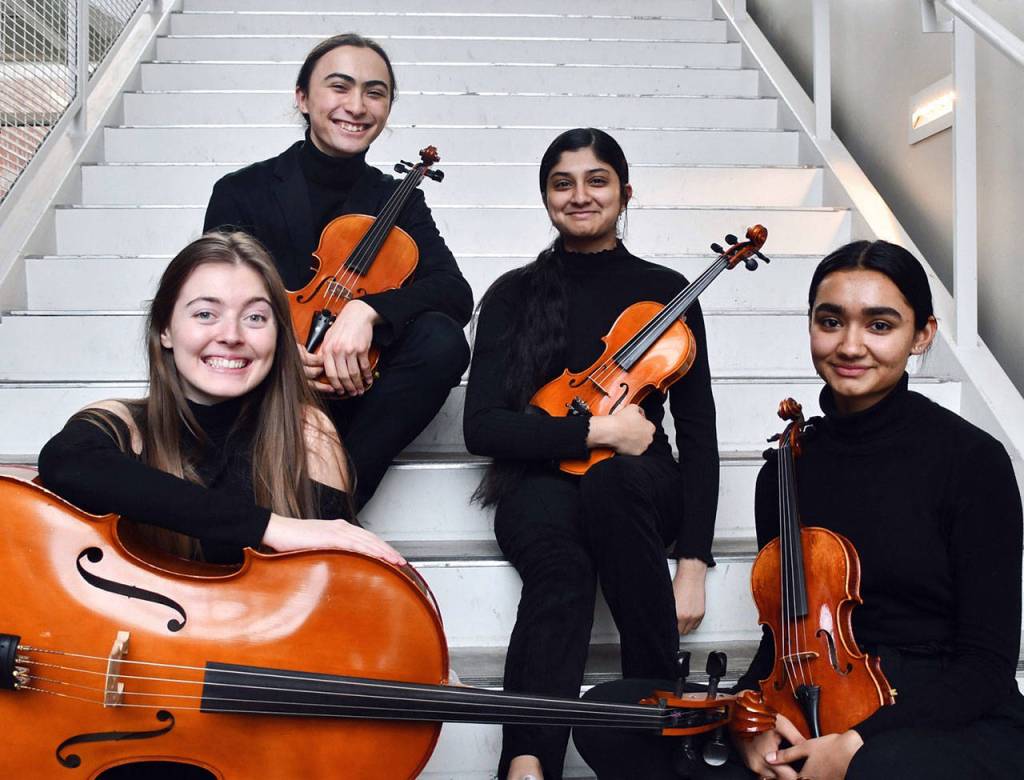 Front row: Teagan Elliott and Thrisha Ramesh; back row: Kai Slesarev-Nogami and Mathangi Venkatesh of Redmond High School. The quartet will be accompanying Satisfaction and Abbey Road at the KPC performance. Photo by Michelle Fairless