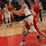 Kang Rosa Smith drives to the hoop against Juanita. Andy Nystrom/ staff photo