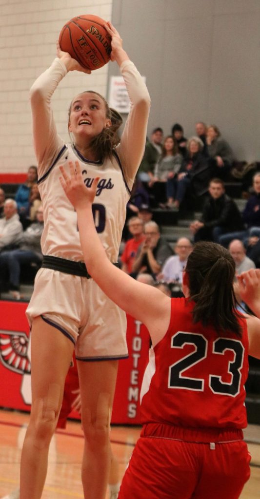 LWs Elise Hani goes up for a shot over Juanitas Joy Haltom. Andy Nystrom/ staff photo