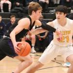 Lake Washington senior Evan Liggett dribbles past Bellevues Danny Rubinstein during a 3A KingCo playoff game on Feb. 11 at Sammamish High School. Benjamin Olson/staff photo