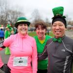Shamrock Run participants from a previous year smile for the camera. Photo courtesy of Orca Running