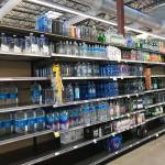 Sections of the water aisle at the Whole Foods in Kirkland were cleared out on March 15. Samantha Pak/staff photo