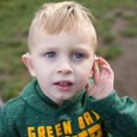 Listen and Talk student listening with his hearing technology. Courtesy photo.